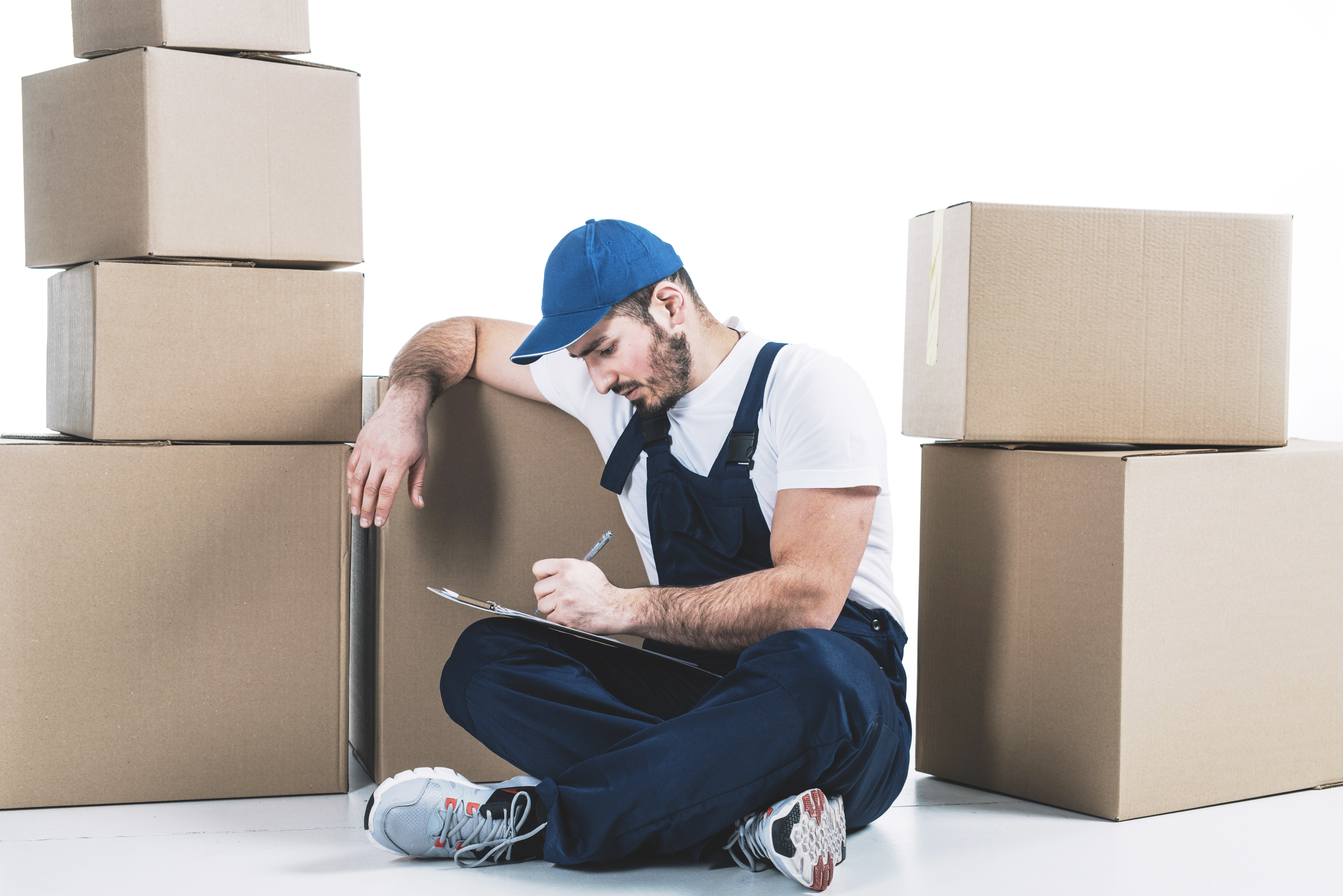 courier writing clipboard near parcels