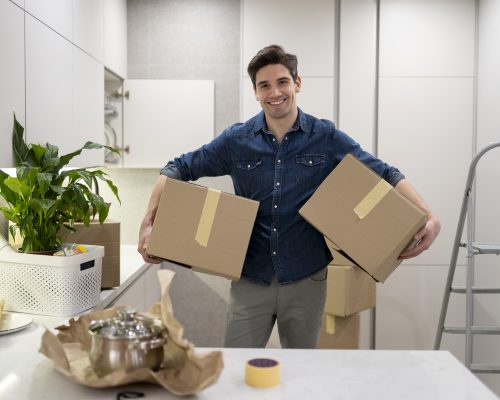 man-handling-two-boxes-belongings
