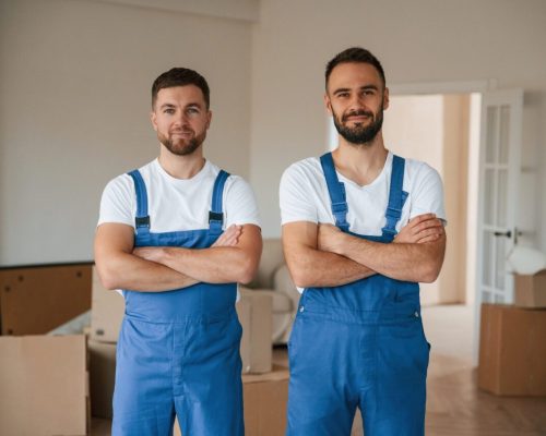 standing-and-posing-two-moving-service-employees-in-a-room.jpg