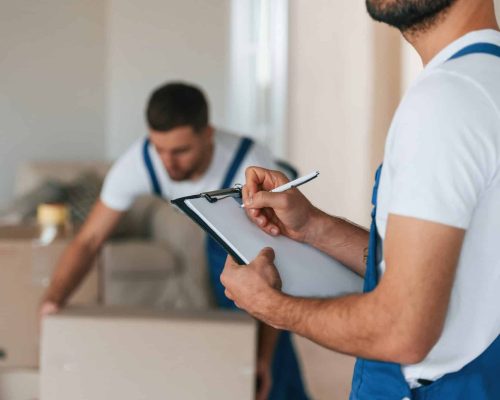 two-moving-service-employees-in-a-room.jpg