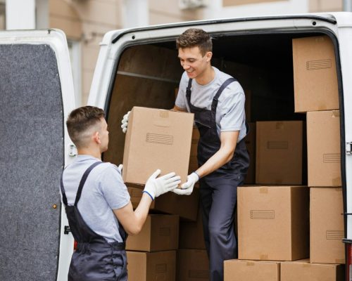 two-young-handsome-movers-wearing-uniforms-are-unloading-the-van-full-of-boxes-house-move-mover.jpg